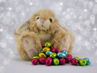 Easter bunny with a pile of Easter eggs.