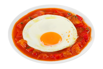 fried egg with vegetables on the plate on white background
