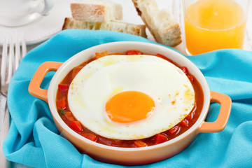 fried egg with bread and orange juice