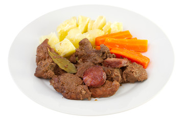 fried meat with sausages, potato and carrot