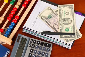 Bright wooden abacus and calculator. Conceptual photo of old