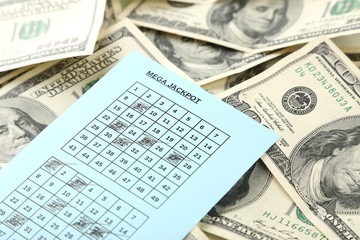 Lottery ticket and money, close up