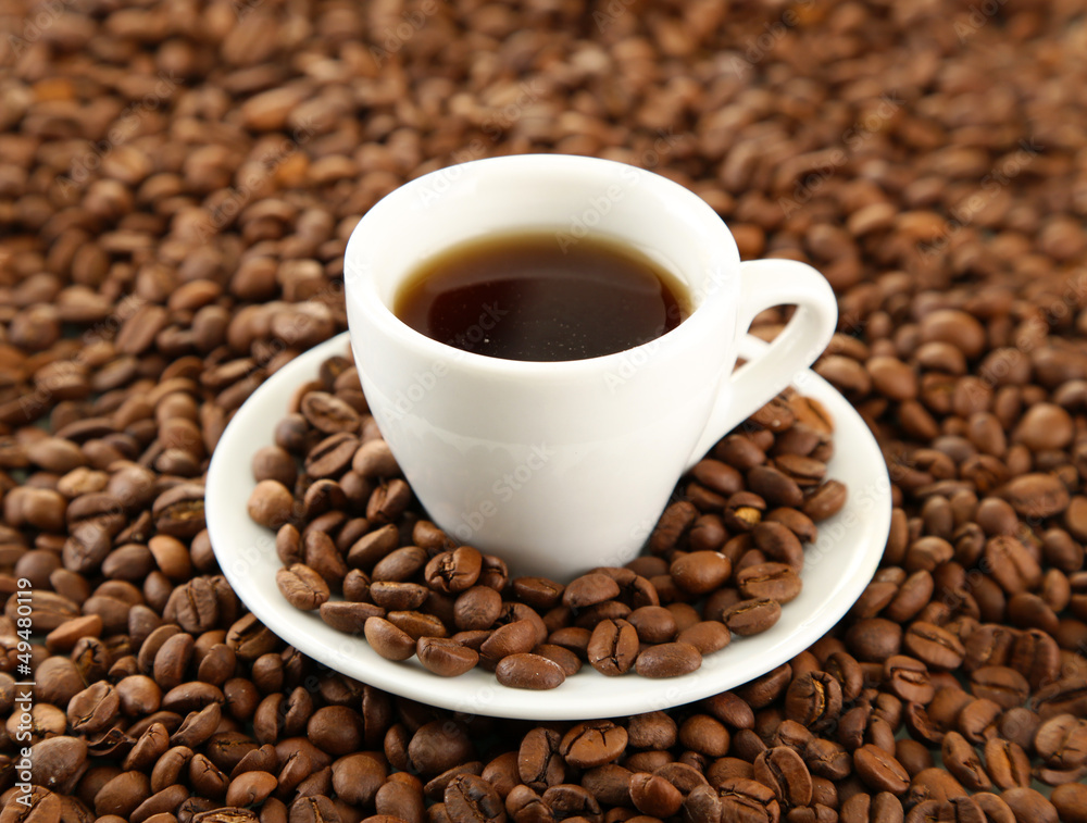 Poster cup of coffee on coffee beans background