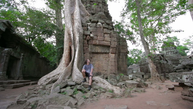caucasian tourist travel in preah khan temple, angkor, cambodia