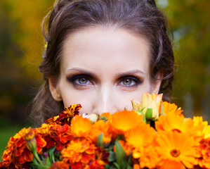 A beautiful brunette with flowers