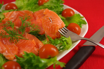 Trout with vegetables on a platter