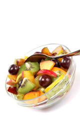 Fresh fruits salad on white background.