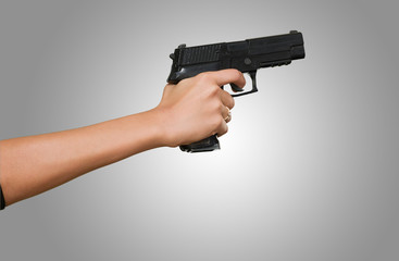 Woman's Hand With A Gun