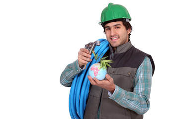 a plumber with a little globe in the hand