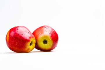two red apples on white background