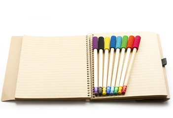 Fototapeta premium pencils on notebook