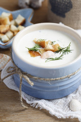 Seafood soup with croutons and dill