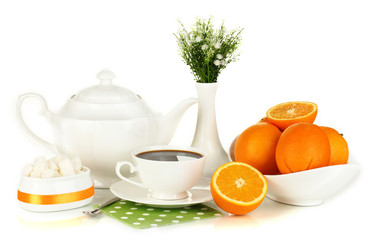 Beautiful white dinner service with oranges isolated on white