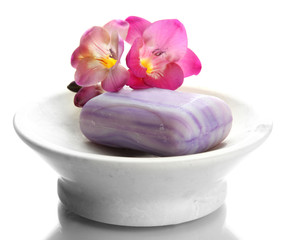 Obraz na płótnie Canvas Soap-dish with soap and flower isolated on white