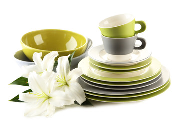Empty bowls, plates and cups isolated on white