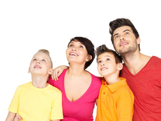 Happy family with two children looking up