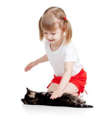 happy child girl playing with cat kitten