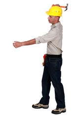 Builder holding hammer over head