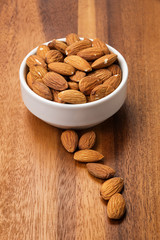 roasted almonds in white porcelain bowl