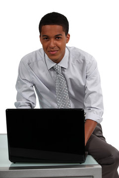Portrait of a young professional working on his laptop
