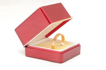 red box with a gold ring as a gift of love
