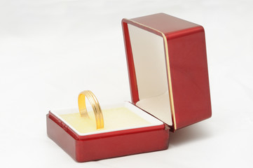 red box with a gold ring as a gift of love