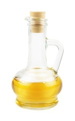 Glass carafe with vegetable oil isolated on white background