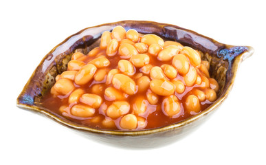 Marinated haricot beans in tomato sauce with shallots on a plate