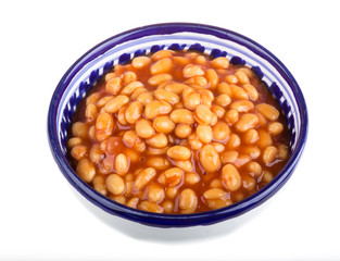 Marinated haricot beans in tomato sauce with shallots on a plate