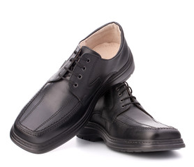 Black glossy man’s shoes with shoelaces