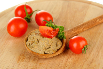 Fresh pate on wooden spoon, on wooden background