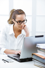 Business woman portrait in an office