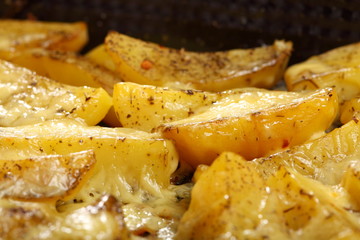 Roasted potatoes with spices and cheese