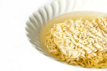 Noodles in a bowl on a white background