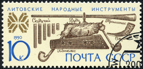 stamp printed in USSR shows Lithuanian folk musical instruments