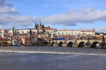 Obraz premium Winter Prague gothic Castle with the Charles Bridge
