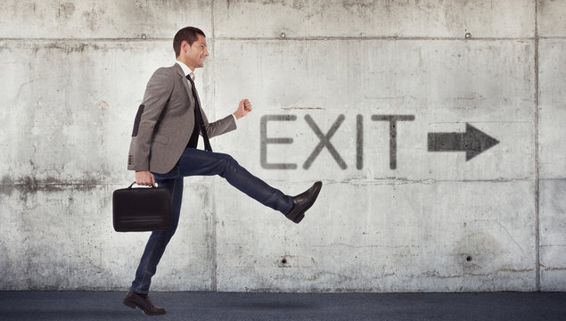 Young businessman going to the exit