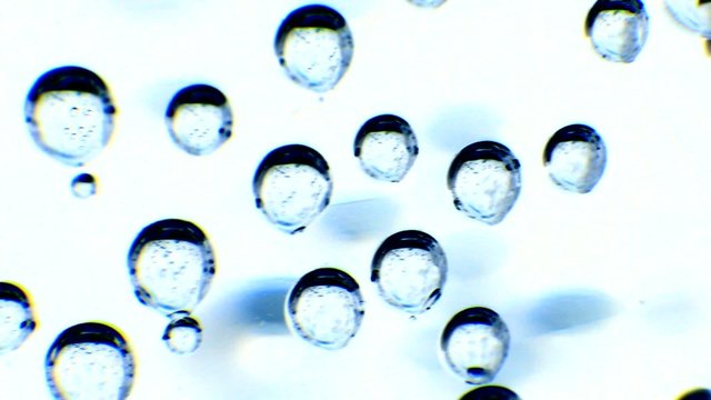 Extreme close up of bubbles. Pan shot.