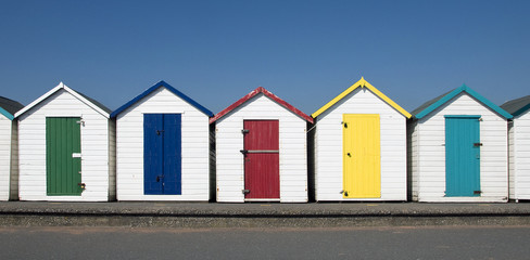 Fototapeta na wymiar Colourful Beach Huts at Paignton, Devon, UK.
