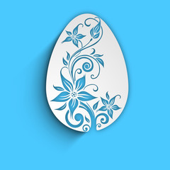 Beautiful floral decorated Easter egg on blue background..