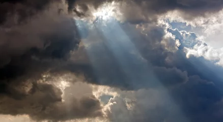 Fotobehang Sun rays through storm clouds © sas