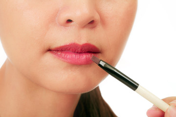 Naklejka premium Isolated closedup on the lips of an asian middle age woman