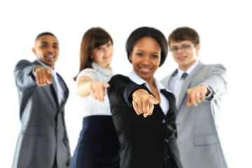 Happy business group poiting at the camera