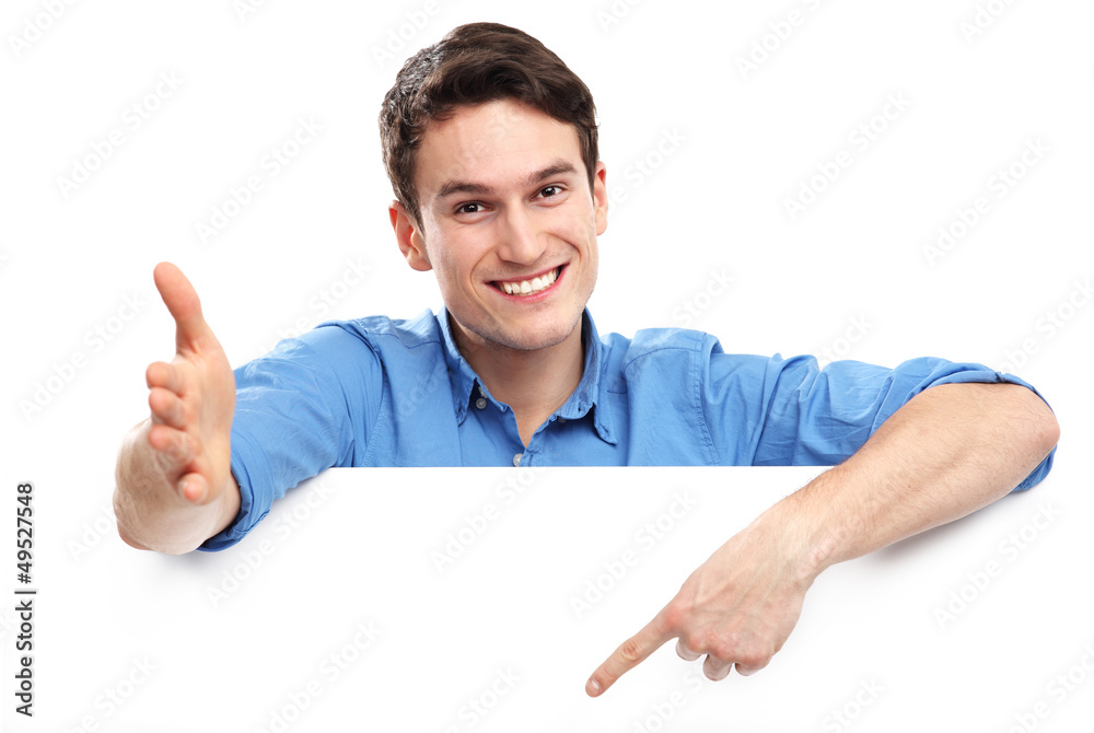 Wall mural man pointing at blank copy space