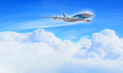 Naklejka na ściany i meble Biały samolot pasażerski w błękitne niebo