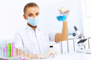 Young female scientist working in laboratory