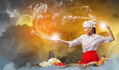 Asian female cooking with magic