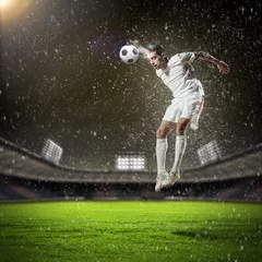 Papier Peint photo Lavable Foot joueur de football frappant le ballon