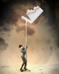 Image of businesswoman climbing the rope