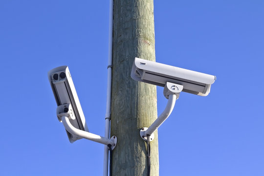 Security cameras on wood pole